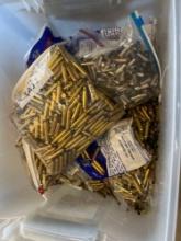 whole tote full of empty shell casings including .357, .223,