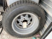 ST205/75R14 Trailer tire and rim. NO SHIPPING AVAILABLE ON THIS LOT!