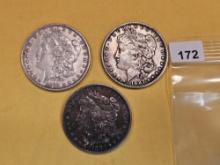 Three Morgan silver dollars