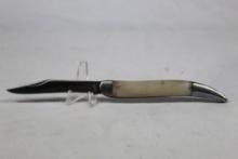 Remington Fish knife with 3.5 inch blade. White synthetic scales. Used.