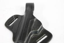 One Tagua black leather left handed thumb break belt holster for Bersa 380. In package.