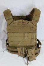 One tan/green flak/utility vest. Plate carrier no plates included.