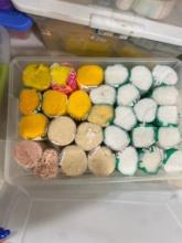 BOX OF WHITE AND YELLOW RUG HOOKING SUPPLIES