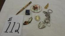 knick knack lot,mustang pin, hand carved wooden pen, large heart keychain and many more items