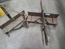 2 antique hand saw stands, one with saw