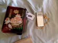 Sharp Pocket Calculator and Oriental Box