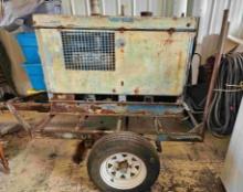 Miller Big 30A Welder Generator Deutz Diesel Air Cooled with Leads mounted on a single axel trailer.