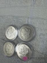 set of four vintage silver dollars