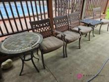 4 metal patio chairs with cushions and 2 tables