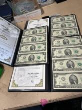 three government issued uncut two dollar bills sheet