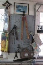 shears, rivet guns machete, gaskets, license pates, scissors, on garage tool board