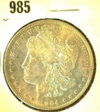 1904 O Morgan Silver Dollar with Natural toning. Brilliant Uncirculated.