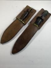 TWO UNMARKED KNIVES IN SHEATHS