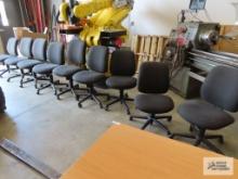 Nine roll about office chairs made by Hon.