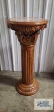 Light wood pedestal with marble like center. 3 ft tall by 16 in. wide