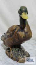 Duck...ceramic figurine. 9-1/2 in. tall. Marked D inside a triangle on bottom.