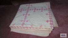 pink and white quilt
