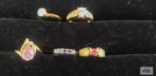 Five costume jewelry rings with gemstones
