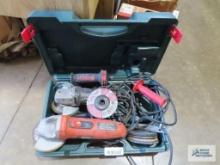 Two Black & Decker angle grinders with accessories and Metabo case