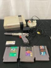 Vintage Nintendo NES, Zapper, 2x Controllers & Adventure Island II, Super Mario Bros & Taboo