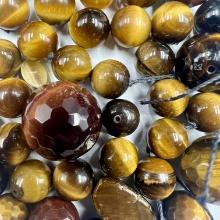 Lot of loose tiger's eye beads & cabochons