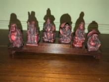 (DEN) SET OF 6 CHINESE CARVED BUDDHA FIGURINES WITH WOODEN STAND, MEASURE APPROXIMATELY 10 INCHES