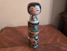 (DR) JAPANESE KOKESHI WRAPPED SCROLL DOLL. MADE OF WOOD. IT MEASURES 9-3/4"T.