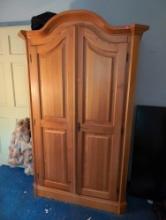 (DBR1) PINE TWO DOOR ARMOIRE WITH THREE INTERIOR SHELVES. IT MEASURES 48"W X 24"D X 77"T. APPEARS TO