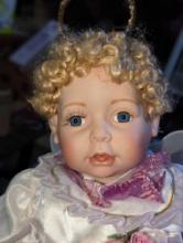 (GAR) Cathey Collection Angel Porcelain Doll with Blonde Hair and Blue Eyes Wearing a with and