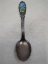 SILVER PLATED COLLECTOR SPOON WITH SORTLAND, KIRKE AND NORGE ON HANDLE AND STAMPED HS60GR ON BACK 4"