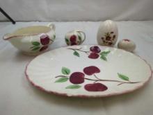 VINTAGE SMALL PLATTER (HAS SMALL CHIP ON RIM) GRAVY BOAT, AND PEPPER SHAKER (NO SALT SHAKER) AND