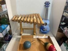 Blue Mahalo ukulele, two maracas, and bamboo percussion