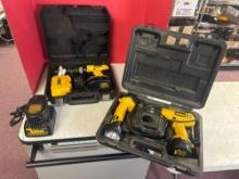 two Dewalt drills with battery and battery charging pac. dewalt work light