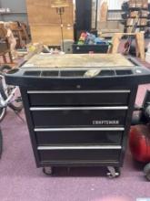 craftsman wheeled toolbox filled with tools