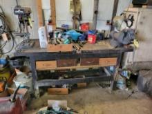 Early shop work bench with metal plate on top and Pittsburgh automatic vice