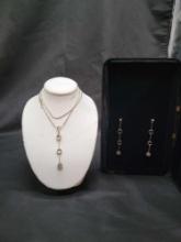 Custom made 14k Gold and Diamond set, sterling chain on 14k pendant