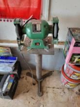 Bench grinder on pedestal base